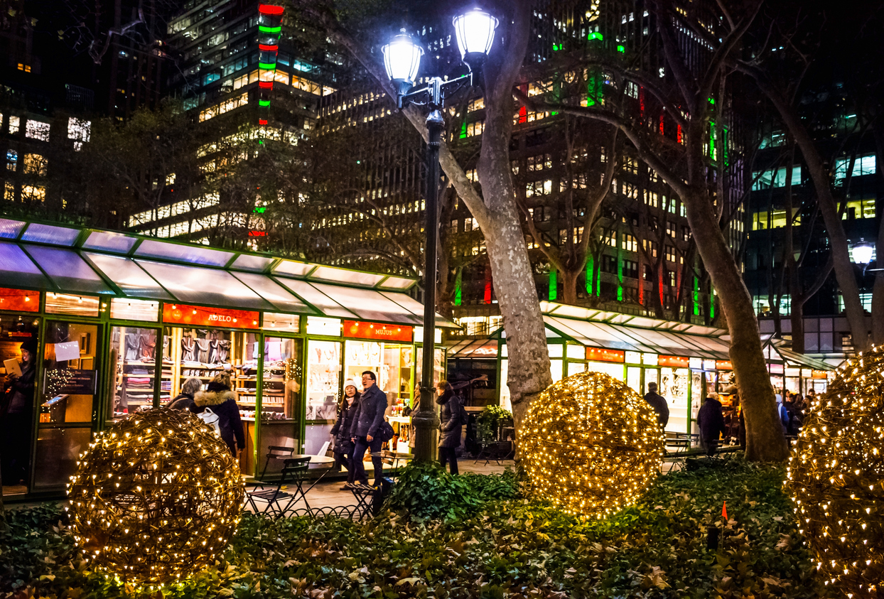 New York, NY, USA - December 14, 2016: Holiday shoppers enjoy the scene of the Winter Village at Bryant Park in Manhattan.